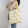 DOUBLE SIDED FRUIT HAND BAG
